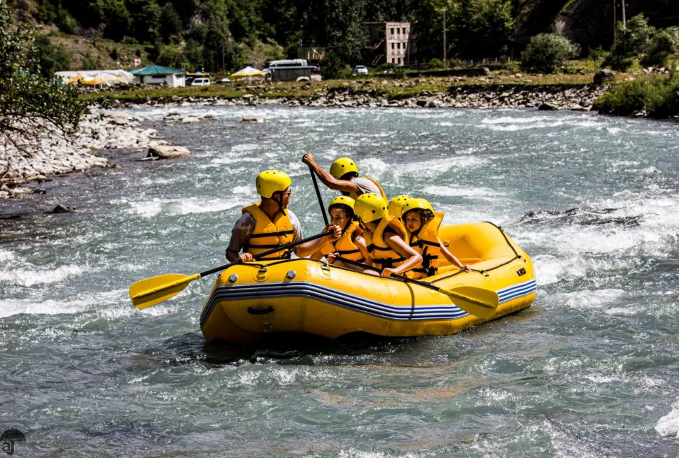 Experience thrilling rafting on the Aragvi River in Ananuri, Georgia, with a vibrant group.