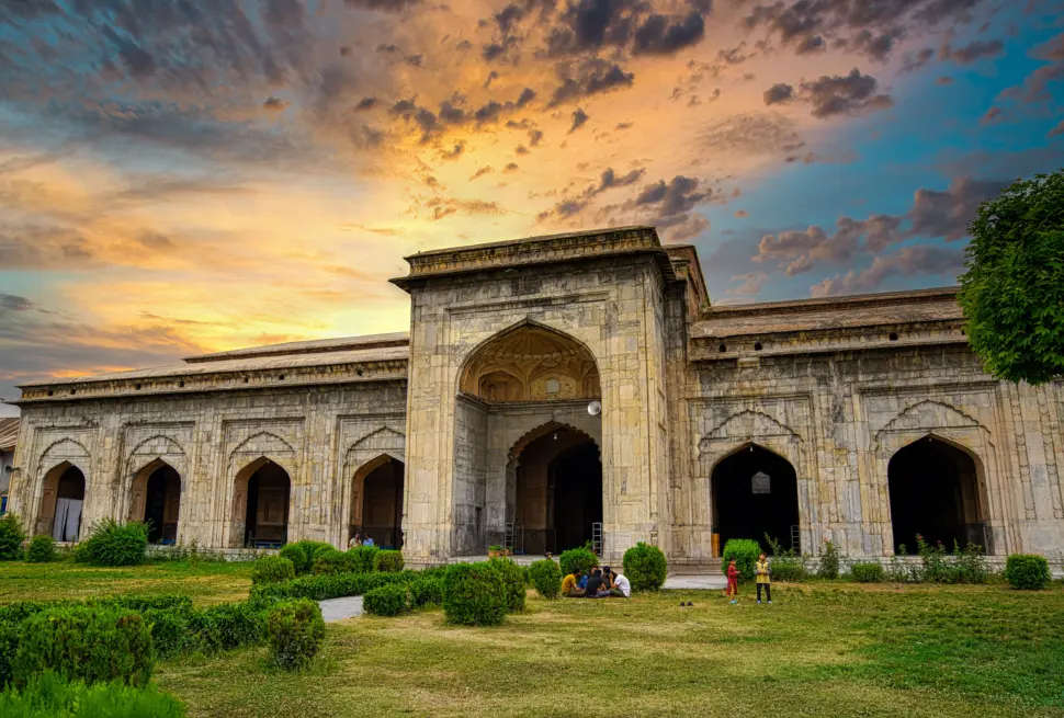 A stunning view of Pather Masjid in Srinagar, Kashmir at sunset showcasing Islamic architecture.